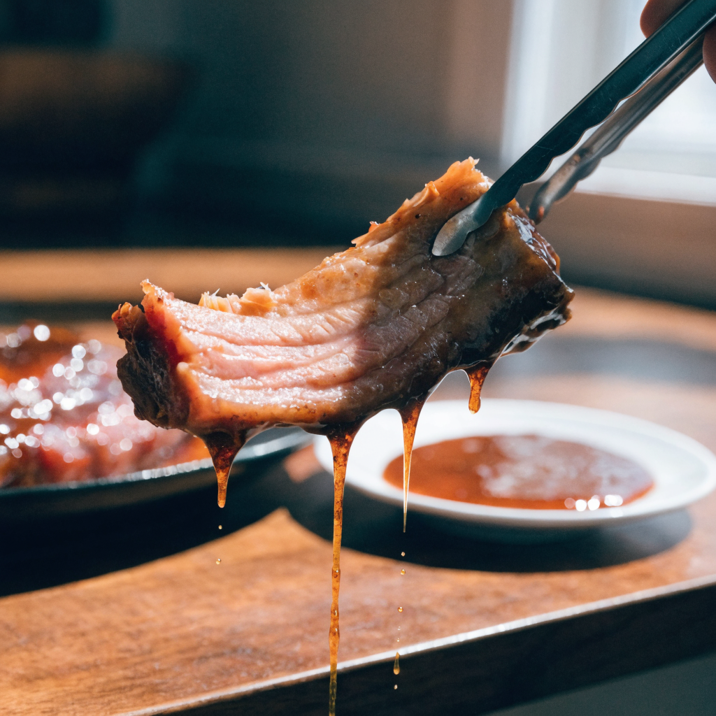 Close-up of oven baked barbecue ribs (melt-in-your-mouth beef short ribs)