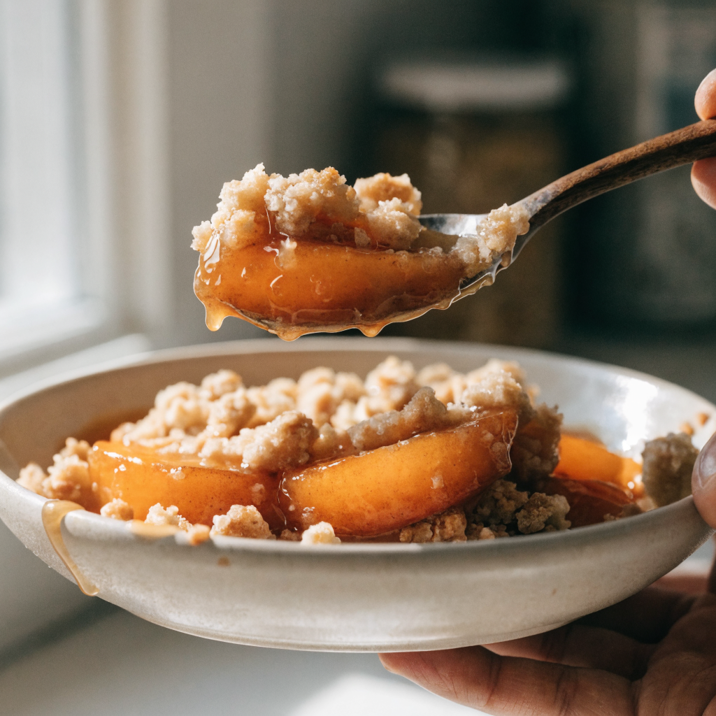 Close-up of fresh peach crisp with browned butter, no oats