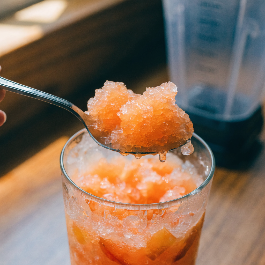Close-up of frozen peach lemonade (silky slush texture)
