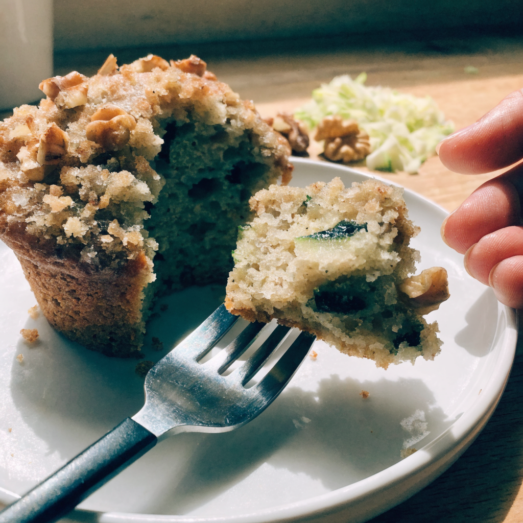 Close-up of zucchini coffee cake muffins with cinnamon-walnut streusel